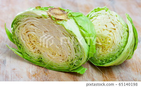 Sliced fresh cabbage on cutting board Sliced fresh cabbage on cutting board 65140198
