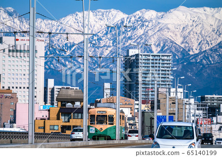 《Toyama Prefecture》Toyama cityscape, tram and Tateyama mountain range 《Toyama Prefecture》Toyama cityscape, tram and Tateyama mountain range 65140199