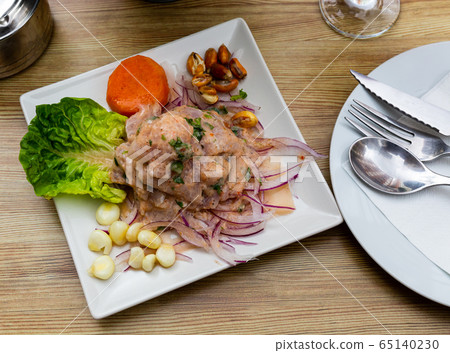 Seafood ceviche from hake with onion and vegetables Seafood ceviche from hake with onion and vegetables 65140230