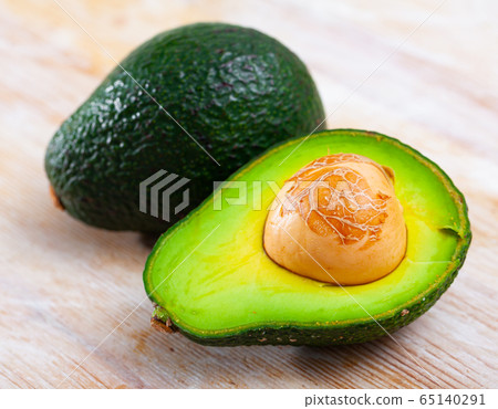 Ripe avocado on wooden table Ripe avocado on wooden table 65140291