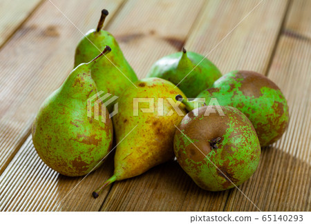 Pears on wooden table 65140293