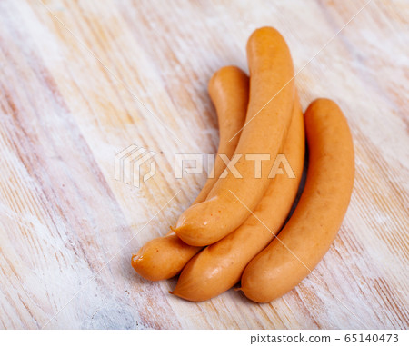 Tasty czech chicken sausages on wooden table Tasty czech chicken sausages on wooden table 65140473