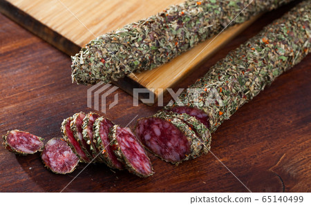 Sliced spanish sausage fuet with herbs Sliced spanish sausage fuet with herbs 65140499