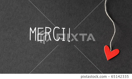 Merci - Thank you in French language with paper hearts 65142335