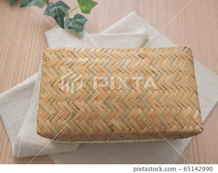 Handmade furoshiki wrapped basket lunch placed on the table Handmade furoshiki wrapped basket lunch placed on the table 65142990