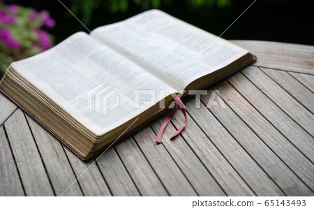 Open bible on wooden table. Soft focus. Copy Open bible on wooden table. Soft focus. Copy 65143493
