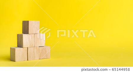 Banner Group of wood stack in human resource management or politics concepts,Teamwork Success Leadership Business Progress, Competition on yellow backgrond and copy space 65144958