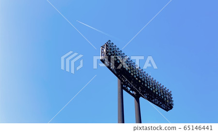 Blue sky, sports lighting and contrails [light blue background] 65146441