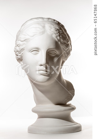Gypsum copy of ancient statue Venus head isolated on white background. Plaster sculpture woman face. Gypsum copy of ancient statue Venus head isolated on white background. Plaster sculpture woman face. 65147868