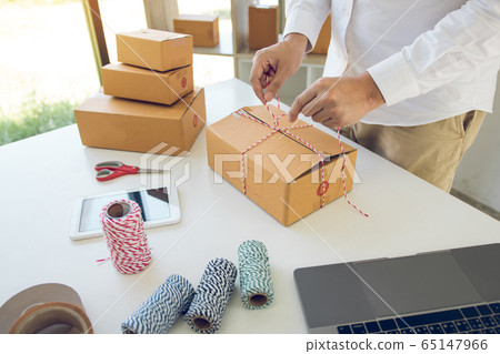 Young asian teenage product owners are packing 65147966