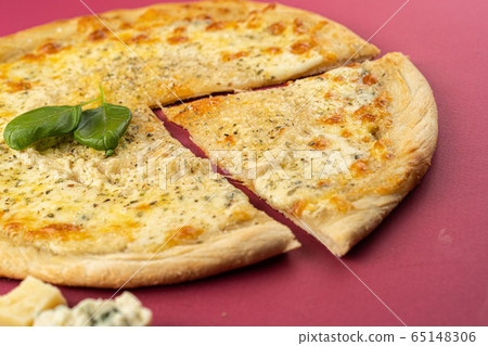 pizza close-up, isolated, against a colored background. whole pizza pizza close-up, isolated, against a colored background. whole pizza 65148306