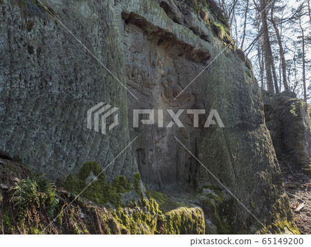 Relief Flight into Egypt sculpted to the sandstone rock in 1740 by joiner Franz Schier in forest near small village Marenicky in luzicke hory, Lusatian Mountains, early spring Relief Flight into Egypt sculpted to the sandstone rock in 1740 by joiner Franz Schier in forest near small village Marenicky in luzicke hory, Lusatian Mountains, early spring 65149200