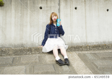 Woman enjoying a walk on a holiday 65149559