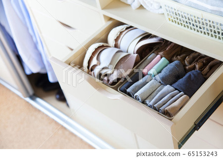 Wardrobe with women's and men's clothing. Drawers with underwear, bed linen, socks and shirts. 65153243