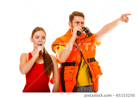 Lifeguards in life vest jacket whistling. Lifeguards in life vest jacket whistling. 65153250