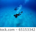 Sandy beach and diver Okinawa's blue sea 65153342