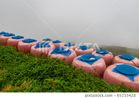 Countryside earthen jar on mountain. 65153428