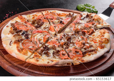 Fresh hot pizza with meat, mushrooms  and cheese 65153617