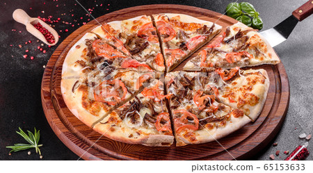 Fresh hot pizza with meat, mushrooms  and cheese 65153633