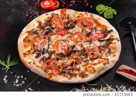 Fresh hot pizza with meat, mushrooms  and cheese 65153663