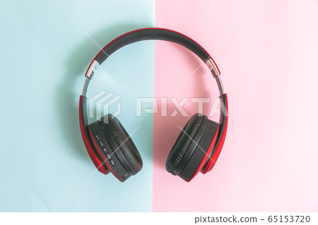 Red headphone pastel color on background. 65153720