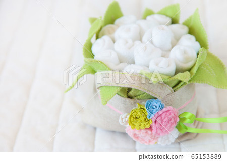 Handmade toy. flowers basket of textiles, fabrics and yarn. Flowers basket sewn by hand. Copy space Handmade toy. flowers basket of textiles, fabrics and yarn. Flowers basket sewn by hand. Copy space 65153889
