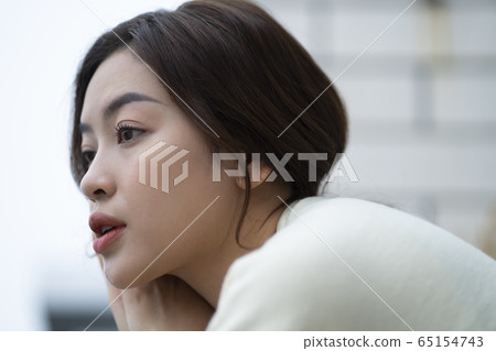 Woman troubled on the terrace Woman troubled on the terrace 65154743