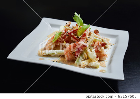 Salad with shrimps and vegetables with sauce. Salad with shrimps and vegetables with sauce. 65157603