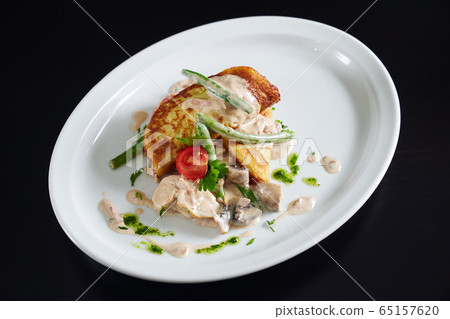 Dish with hash brown and chicken in restaurant. Dish with hash brown and chicken in restaurant. 65157620