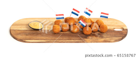 Dutch traditional snack bitterbal on a serving Dutch traditional snack bitterbal on a serving 65158767