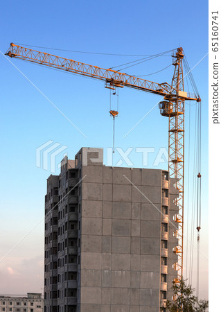 crane and building under construction crane and building under construction 65160741