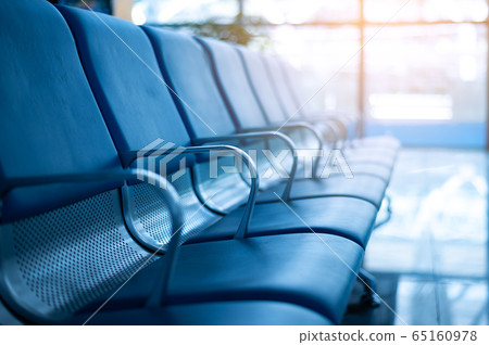 Empty a row of seat in airport terminal without passenger while virus outbreak Empty a row of seat in airport terminal without passenger while virus outbreak 65160978