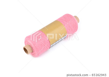 Color bobbin of yarn with label. Side view. Textile reel on isolated white background Color bobbin of yarn with label. Side view. Textile reel on isolated white background 65162943
