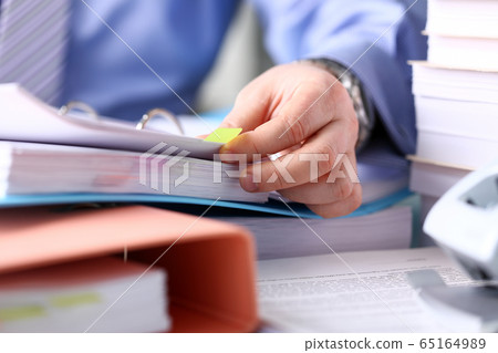 Man having deadline and working hard 65164989