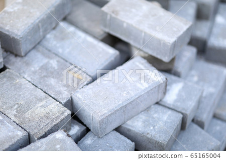 Pile of gray walkway slab lying down outdoor Pile of gray walkway slab lying down outdoor 65165004