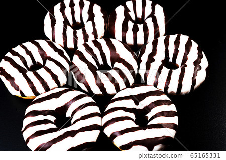 Sweet donuts on dark background. Top view. 65165331