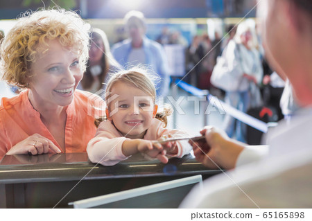 Portrait of mature woman carrying her cute little Portrait of mature woman carrying her cute little 65165898