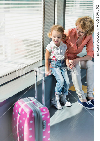 Portrait of mature woman with her cute little 65166302