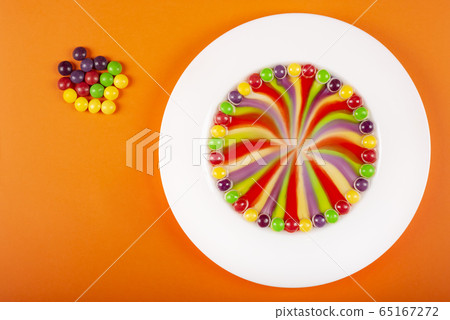 Rainbow swirl made from fruit-flavored colorful Rainbow swirl made from fruit-flavored colorful 65167272
