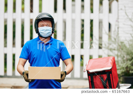 Courier delivering packages Courier delivering packages 65167663