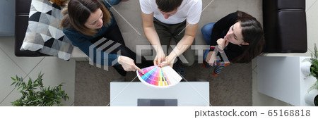 Girlfriends choose color from palette guy holds Girlfriends choose color from palette guy holds 65168818