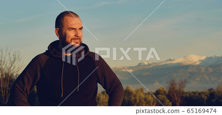 Man pose against Sierra Nevada mountains 65169474