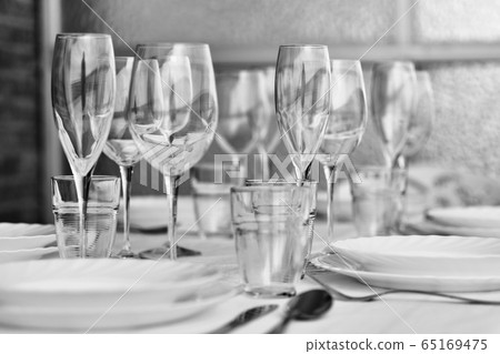 Table settings with diverse glassware Table settings with diverse glassware 65169475