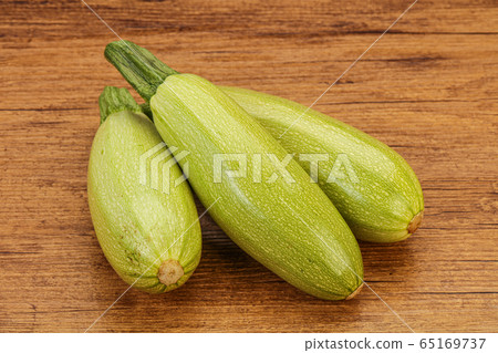 Young tasty zucchini over board Young tasty zucchini over board 65169737