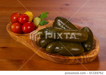 Pickled cucumbers in the bowl 65169762