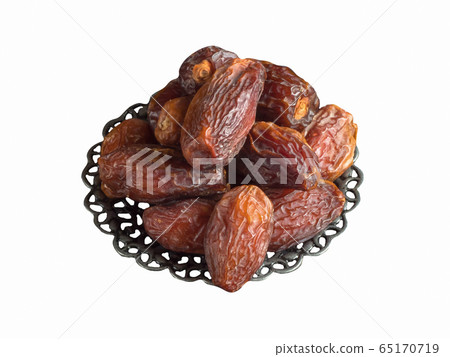 Isolated Saudi dates fruits in a bowl. Top view Isolated Saudi dates fruits in a bowl. Top view 65170719