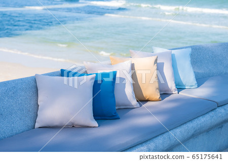 Pillow on chair or sofa lounge around outdoor patio with sea ocean beach view Pillow on chair or sofa lounge around outdoor patio with sea ocean beach view 65175641