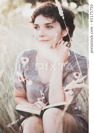girl reads a book 65175750
