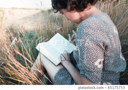 girl reads a book 65175753