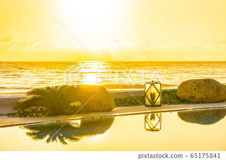 Beautiful luxury outdoor swimming pool in hotel resort for holiday vacation Beautiful luxury outdoor swimming pool in hotel resort for holiday vacation 65175841
